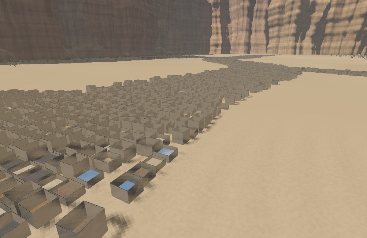 Overhead view of branching reflective tin containers between detailed AlUla sandstone cliffs