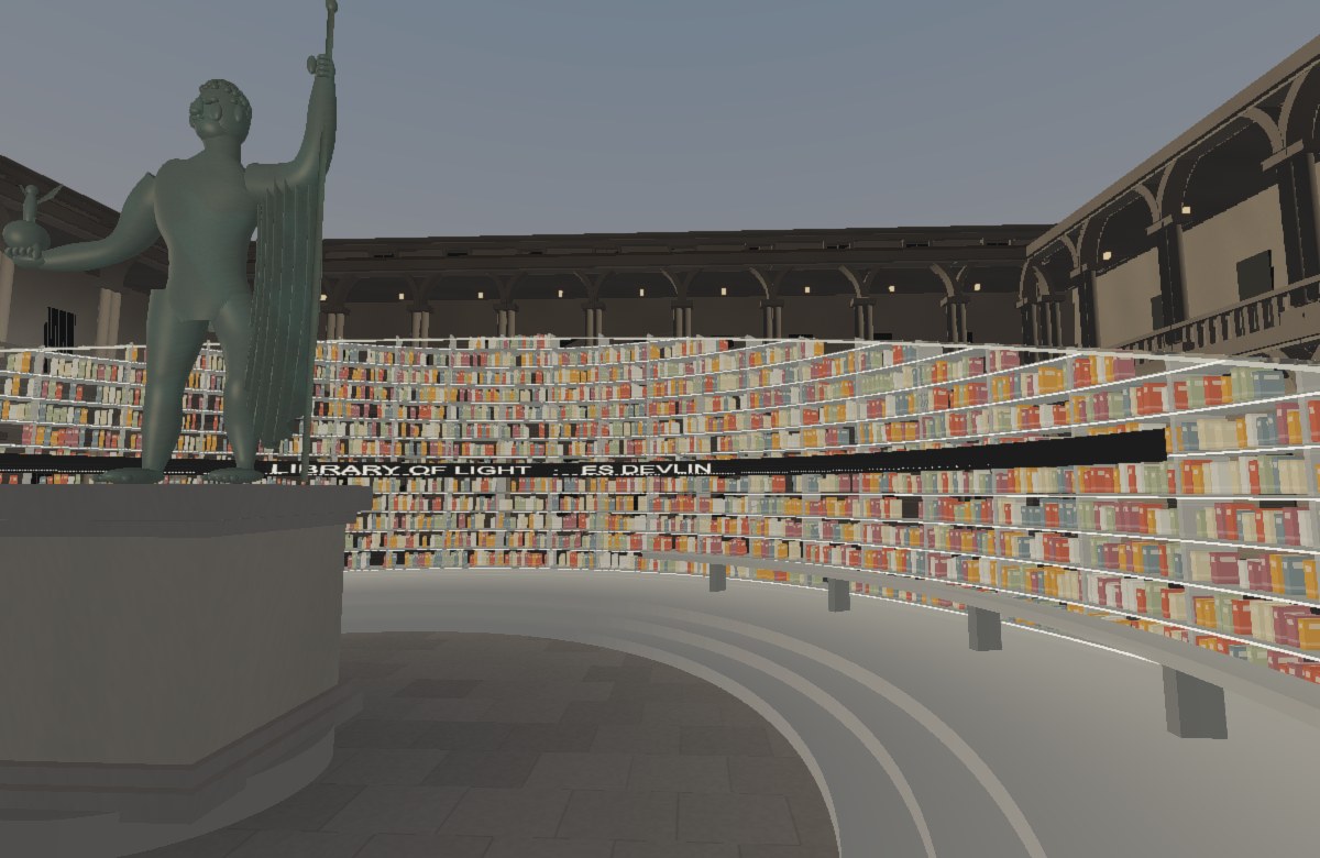 Illuminated curved bookshelves surround a bronze figure in a two-storey arcaded courtyard