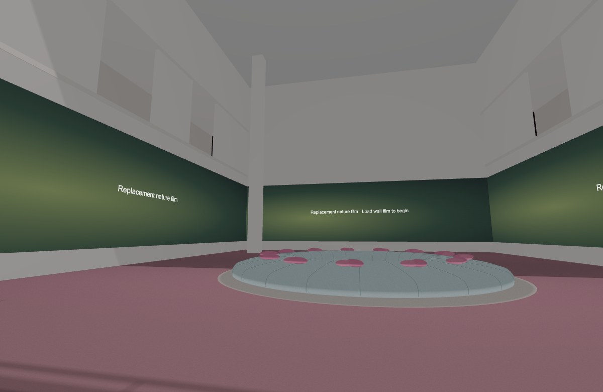 Large botanical color projections surrounding a pink oval seating island